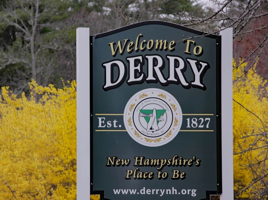 Black wood sign with words Welcome to Derry, Est. 1827
