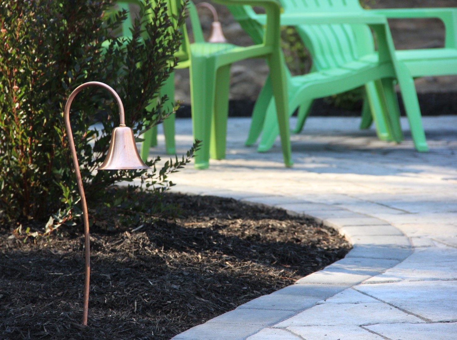 landscape path light in planting bed